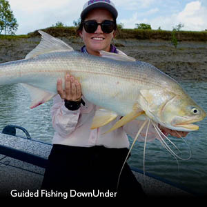 Guided Fishing DownUnder charter guest holding a king threadfin salmon