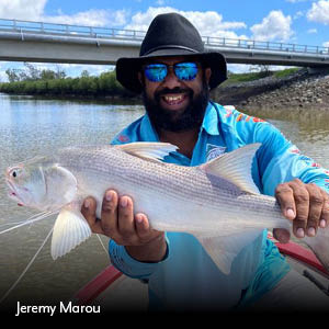 Jeremy Marou holding a king threafin salmon