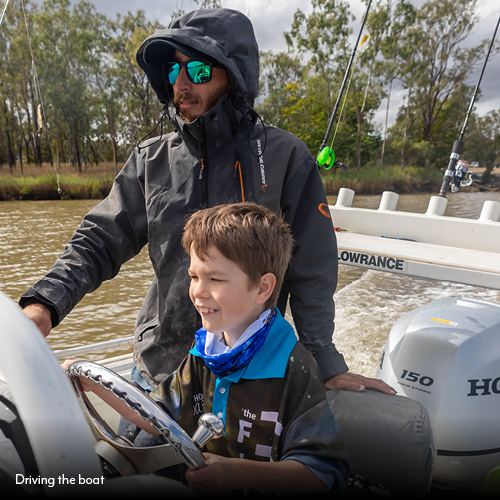 Insiders Guide to Fishing the Fitzroy_Driving the boat.jpg