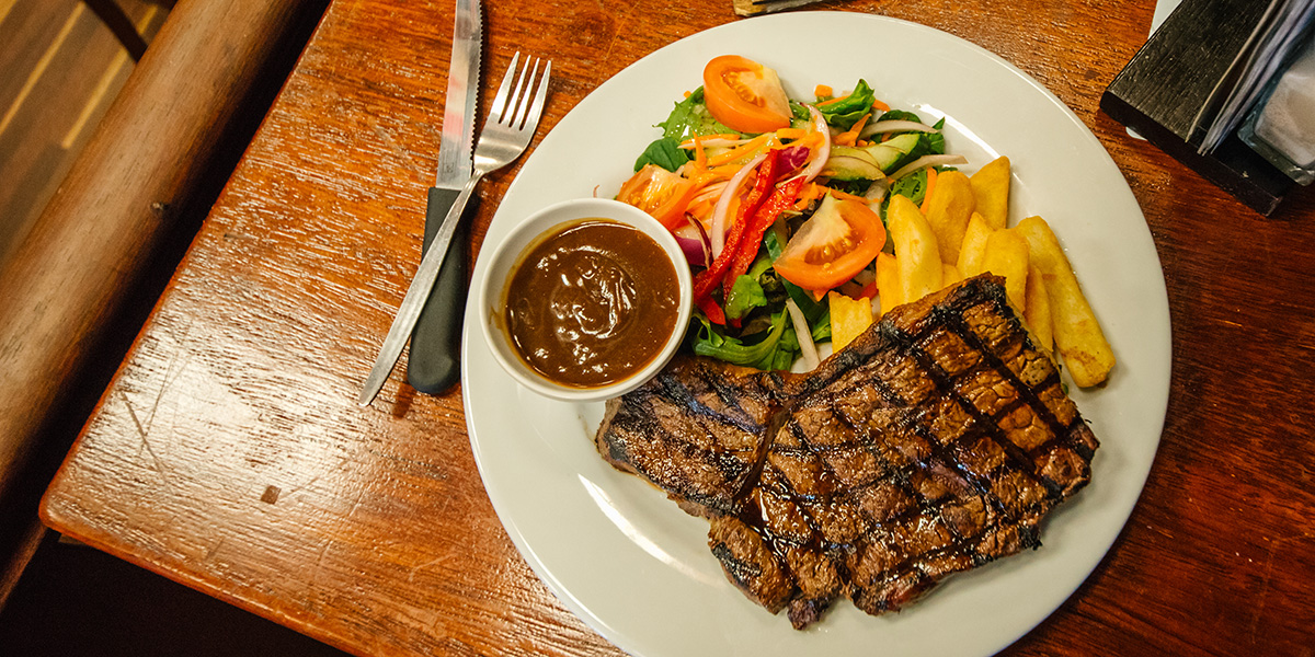 a steak on a table at the Criterion Hotel in Rockhampton