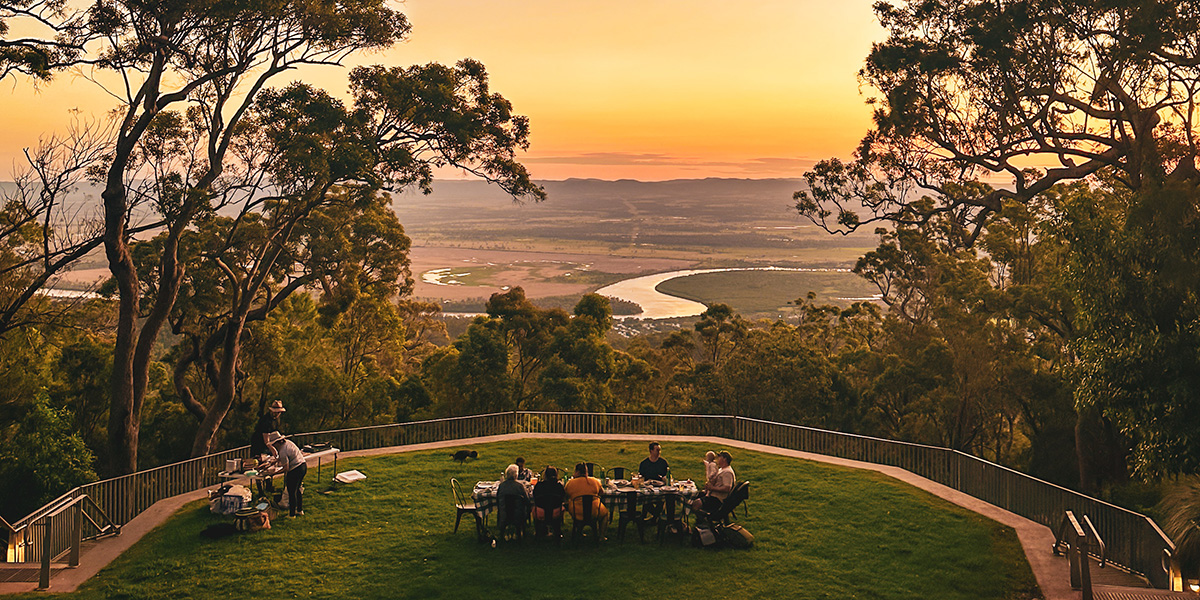 a picnic set up in the Mount Archer amphitheatre with sunset views