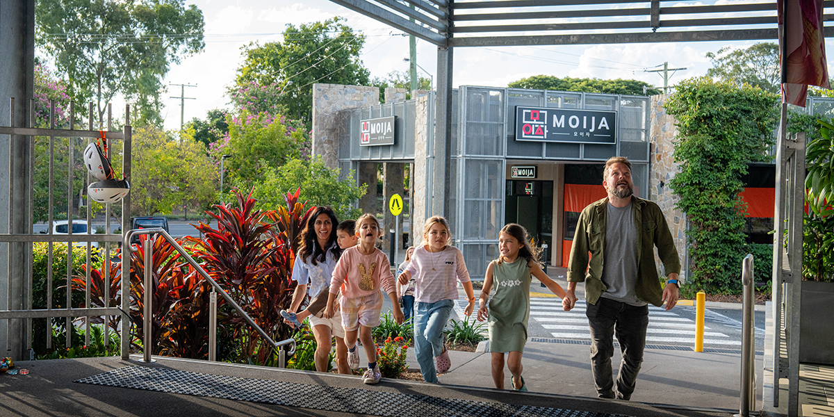 Young family with four children walk the steps to The Terrace at Stockland Rockhampton Shopping Centre.