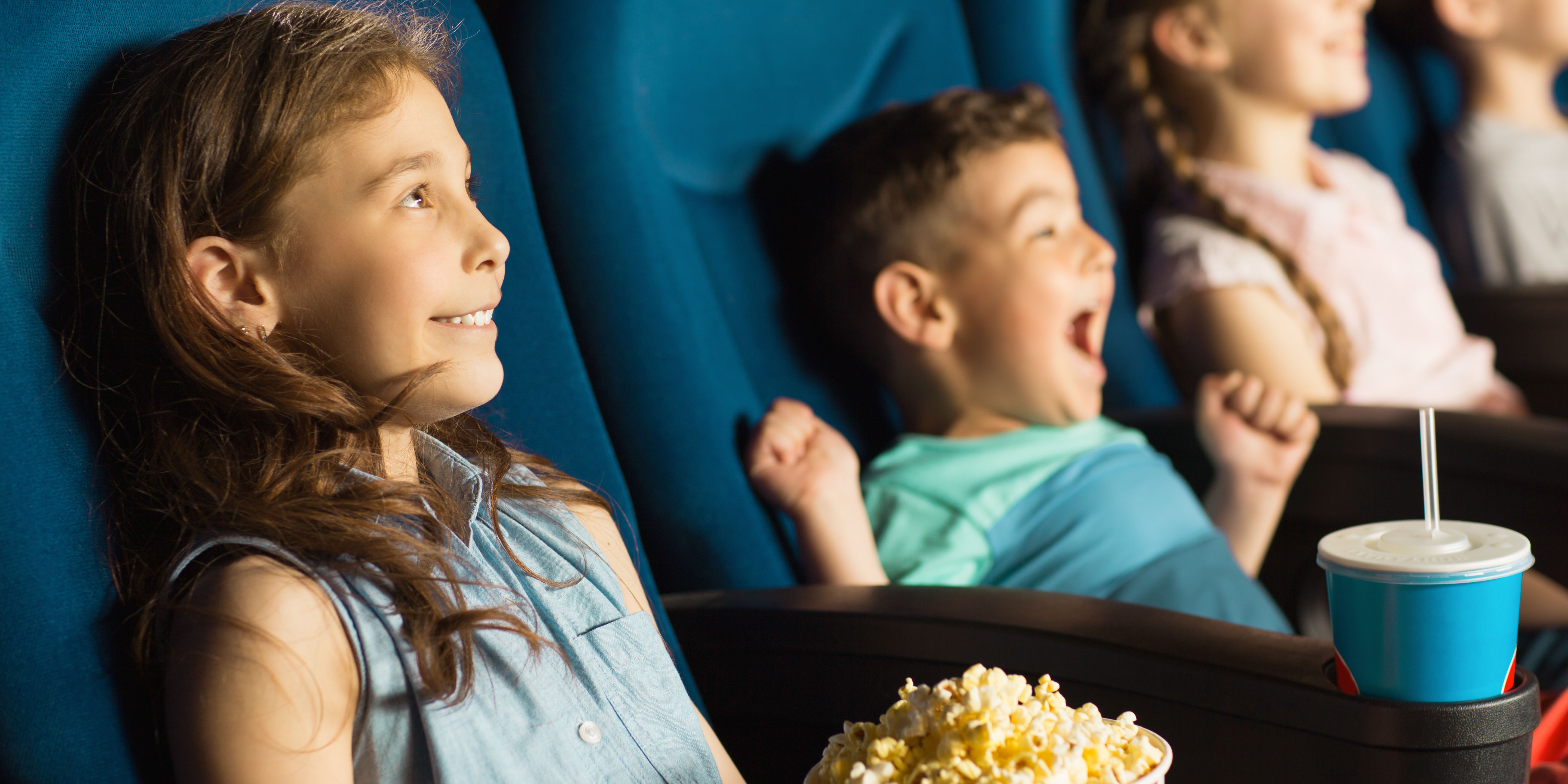 children enjoying the movies