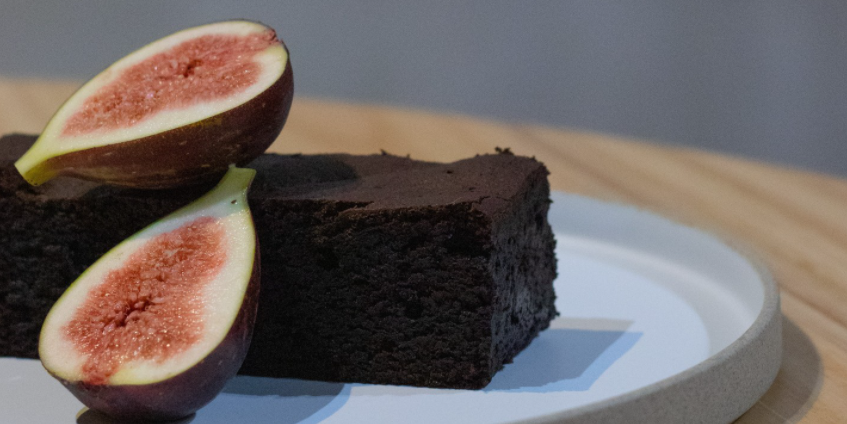 Close up of chocolate cake and fig cut in half