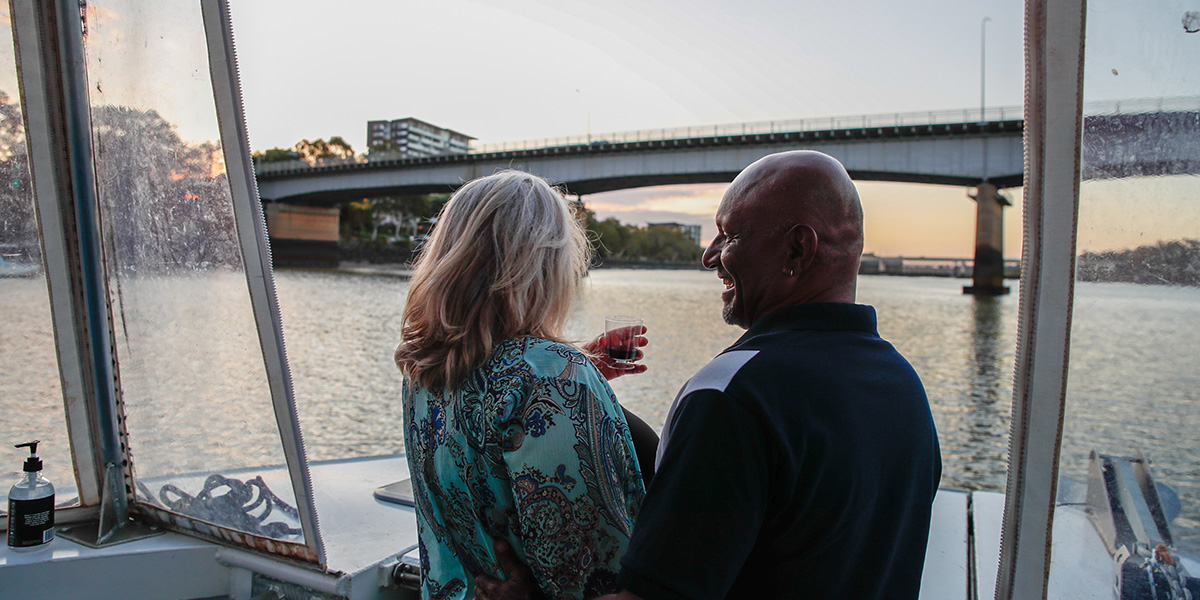 a couple enjoying a river cruise