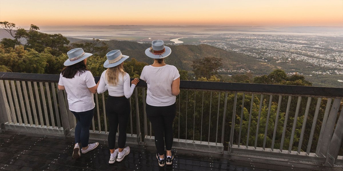 3 women overlooking a sunrise at Nurim Circuit.