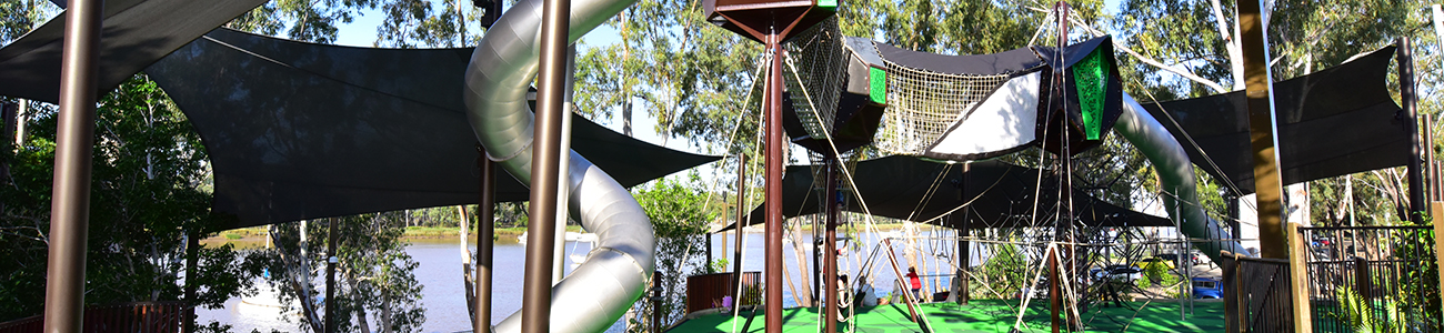 a kids playground beside the river in the CBD