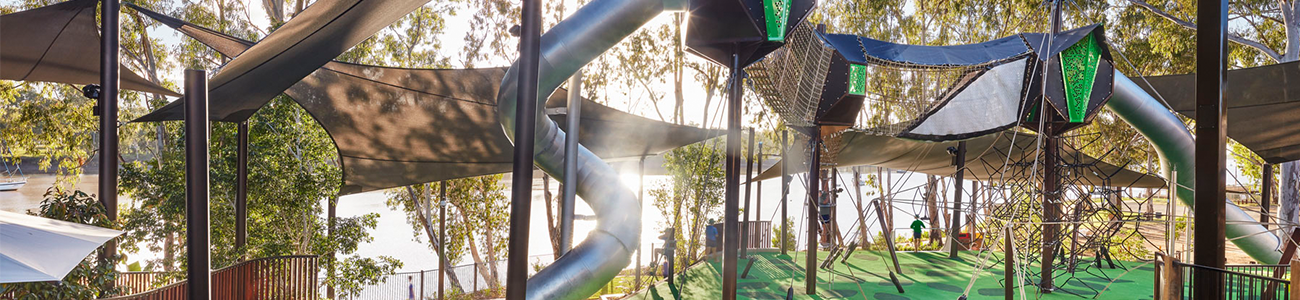 a kids playground beside the river in the CBD