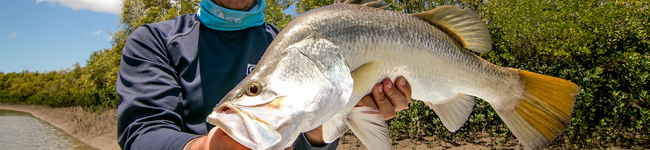 Man holding a trophy sized barramundi