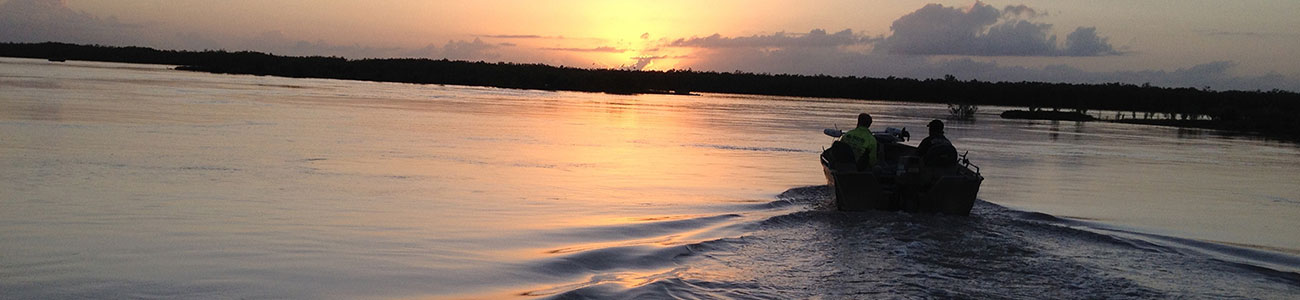 A boat at sunset on the river